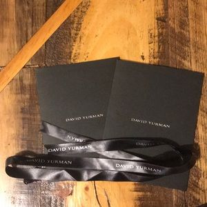 Two David Yurman care cards + ribbon